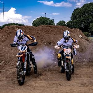 Two people riding motorbikes 