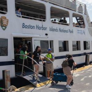 People stepping off of a ferry boat