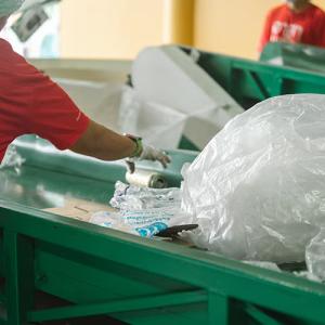 Mixed plastic packaging on a conveyor belt
