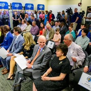People sitting in chairs in a room