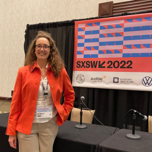 Nicola Acutt, vice president of ESG at VMware, stands at SXSW 2022 booth