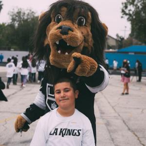 LA Kings mascot Bailey joins the students for a ball hockey clinic led by the LA Kings Hockey Development team.