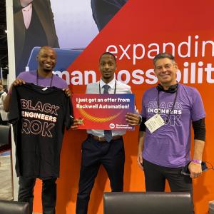 NSBE attendee Ladonte Cole (center) celebrates his offer with Rockwell’s Cheldon Brown (left) and Chris Nardecchia. 