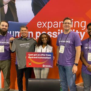 NSBE attendee Salina Tekele (center) celebrates her offer with (from left to right) Rockwell’s Dylan Kachigian, Chris Nardecchia, James Cayemberg, and Yonas Habte.