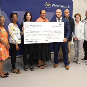 Group with an oversized check