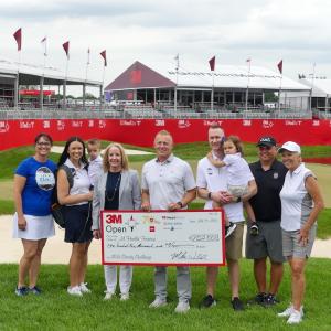 Cameron and group shown with foundation check for $102,000.
