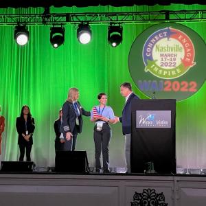 Daisy pictured with Chip Long, VP of Flight Operations, and Lori Cline, MD of Flight Training Standards.