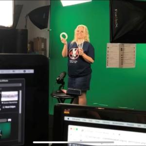 Person performing in front of a green screen