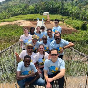 Bridges to Prosperity 2022 Team posing on Kagarama Suspended Bridge in Rwanda