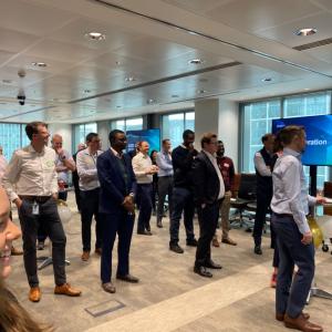 A group of people stood inside an office attending the ACE celebration 2024 event