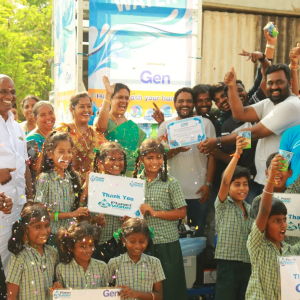 A crowd of adults and children celebrating