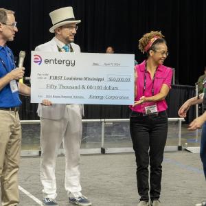 People holding a large check