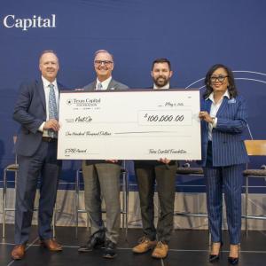 Four people standing together