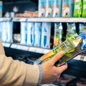 Someone in a grocery store examining an item