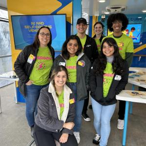 Employee volunteers in Curiosity Cube