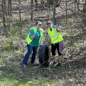 Two people in safety vests giving thumbs up