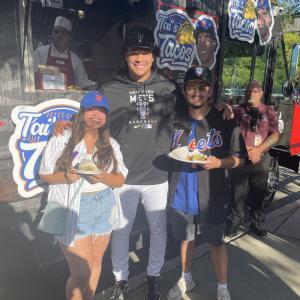Kids posing in front of Tai's Taco Truck