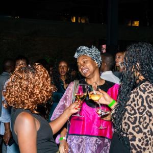 Attendees at Glow Hour (DJ set, celebration toast, & joyful connection)