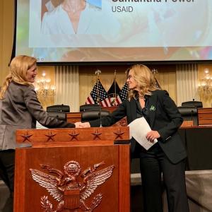 Laura Kohler shakes hands