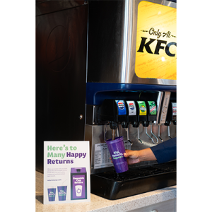 A reusable purple cup being filled