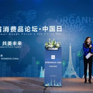 woman on stage presenting