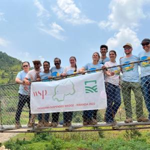 Bridges to Prosperity 2022 Team posing on Kagarama Suspended Bridge in Rwanda