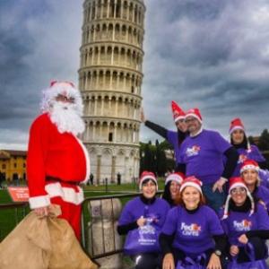People stood in front of the leaning Leaning Tower of Pisa