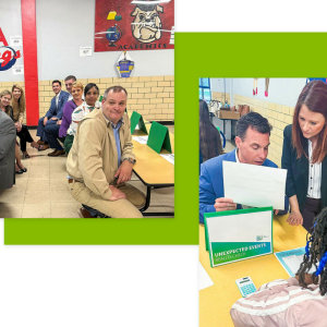 People attending an event and looking at printed materials