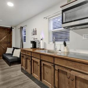 View of kitchen with bedroom visible behind it