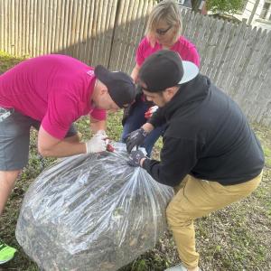 People bagging yard waste