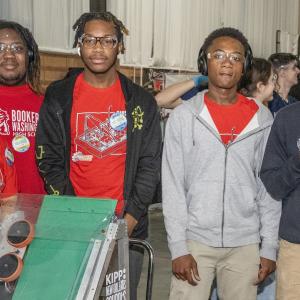 People standing together in red t-shirts