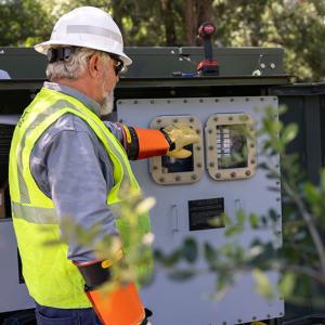 Worker in a hard hat and reflective vest working outside