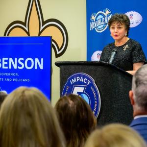 A person talking behind a podium