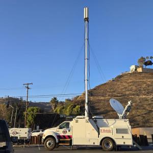 A T-Mobile vehicle below a structure on a hill