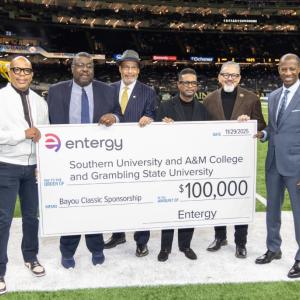 group holding up large check