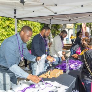people working at a booth