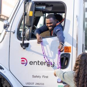 person handing out beads
