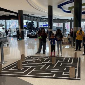 Rockwell’s Alona Talley (R) assists a student.  