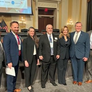 Laura Kohler poses with 6 other people