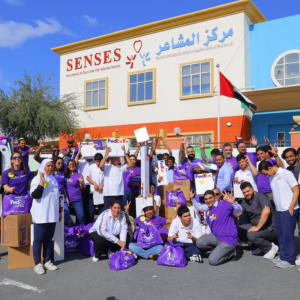 A group photo of people in front of a building 