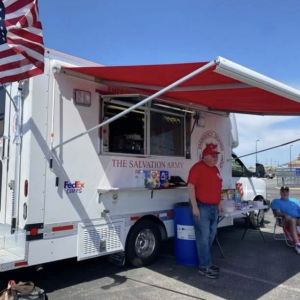 Two people outside a FedEx canteen truck