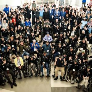 People waving for a large group photo