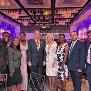 Steve Rusckowski stands with seven others