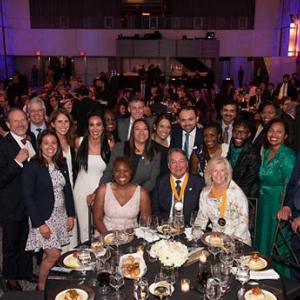 Steve Rusckowski with a group of people at a awards dinner