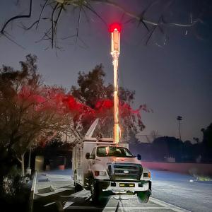 A T-Mobile vehicle in a parking lot at night