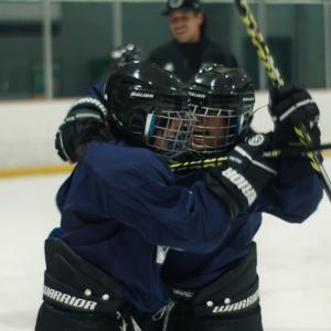 students playing hockey