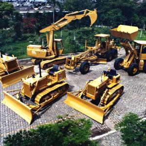 6 yellow construction trucks