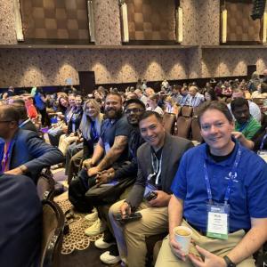 An audience sat on chairs 