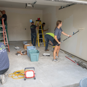people working in a garage