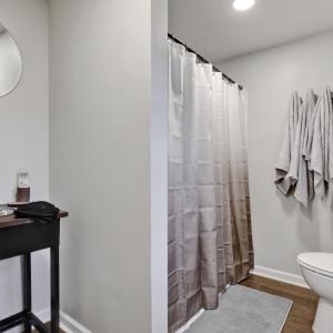 Bathroom with shower, sink and toilet